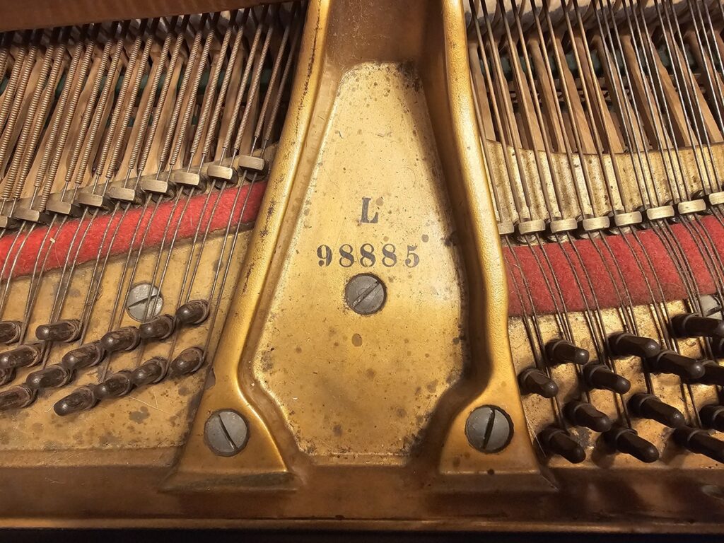 Close-up of the serial number on a Baldwin Model L grand piano.