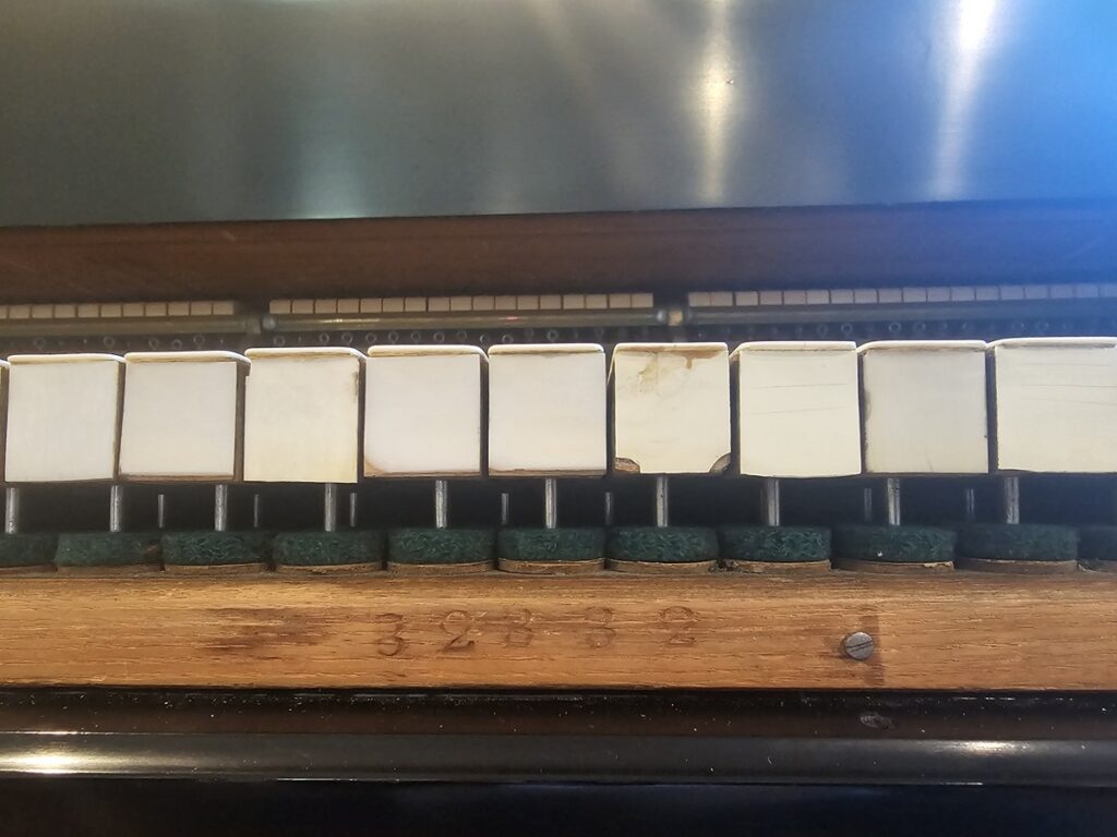 Steinway serial number located on grand piano action.