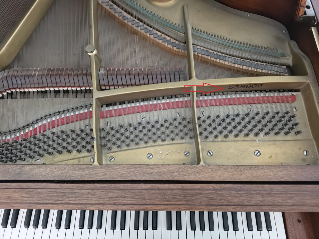 Old Kimball grand with the lid open and the music rack removed.