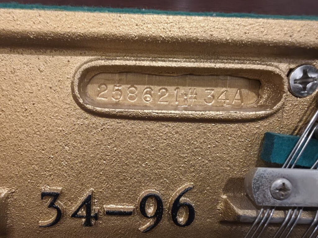 Close-up of a Sohmer upright piano's serial number.