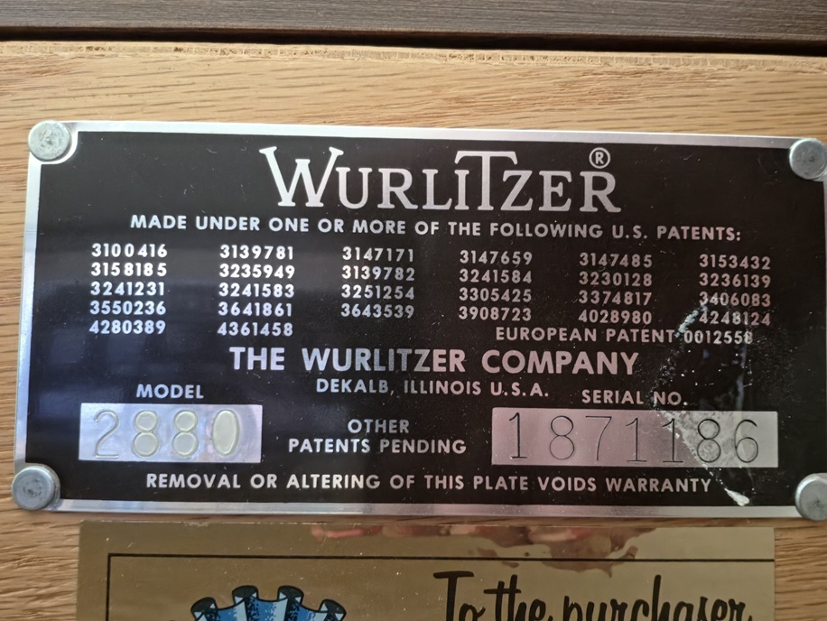 Close-up of the serial number on the back of a Wurlitzer studio piano.