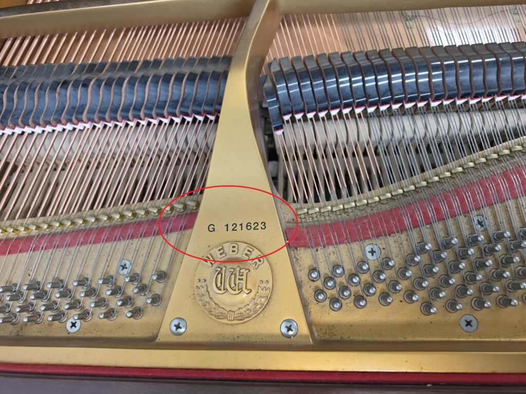 Close-up of the serial number on a Weber grand piano.