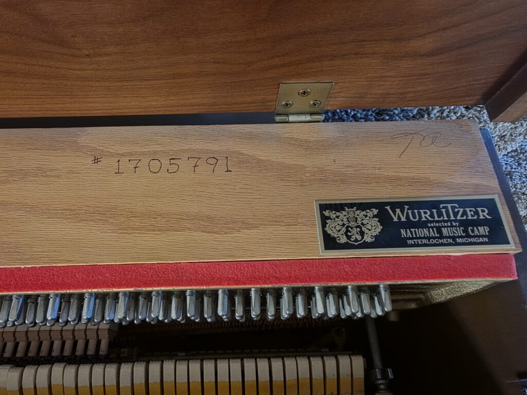 On this Wurlitzer console piano, the serial number is burned into the wood.